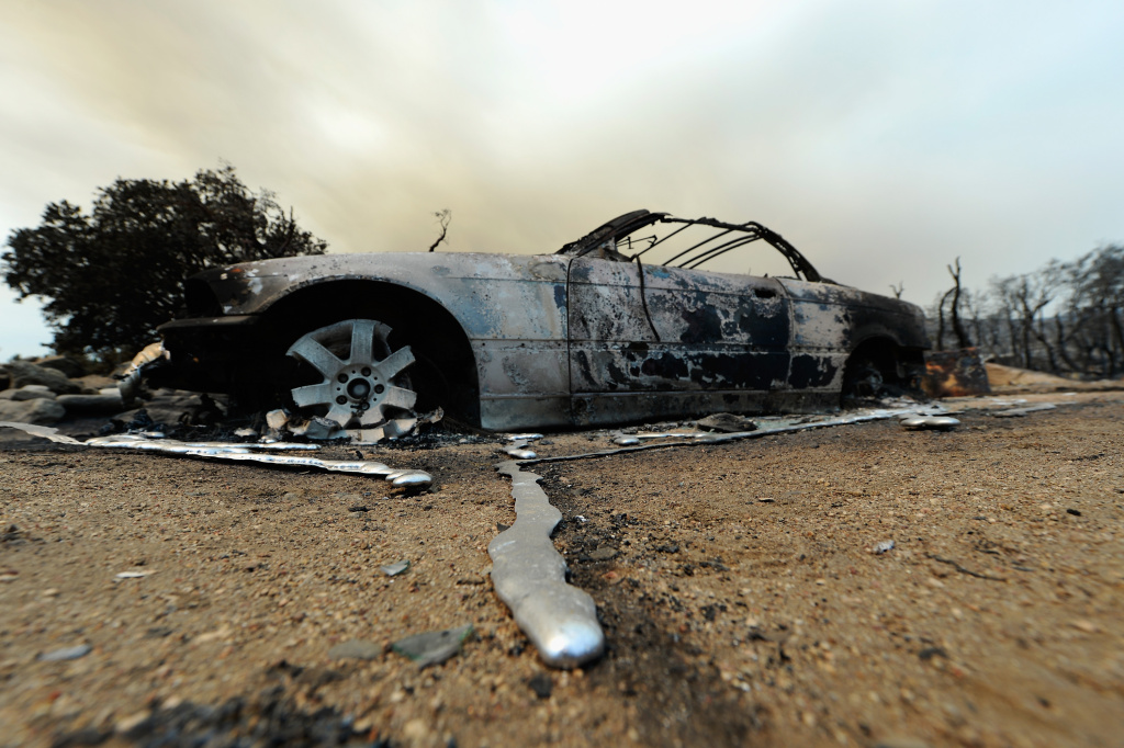 Mountain Fire In Southern California Grows In Strength Liquified metal from a burned-out BMW car next to destroyed home is shown after the Mountian Fire scorched the area on July 18, 2013 near Idyllwild, California. The massive wildfire in Riverside county has grown to 23,000 acres and is advancing towards the mountain town of Idyllwild on one front and city of Palm Springs on the other front destroying several homs and forcing the evacuation of 6,000 people.