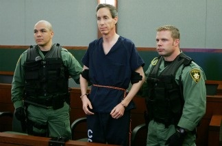Mercer 20163 Warren Jeffs (C) is held by two Las Vegas Metropolitan Police Department SWAT officers during his extradition hearing in Las Vegas Justice Court at the Regional Justice Center August 31, 2006.