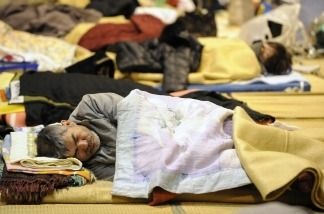 Mercer 15977 A survivor of the March 11 quake in Japan stays in a refugee shelter in a school in northeast Japan.