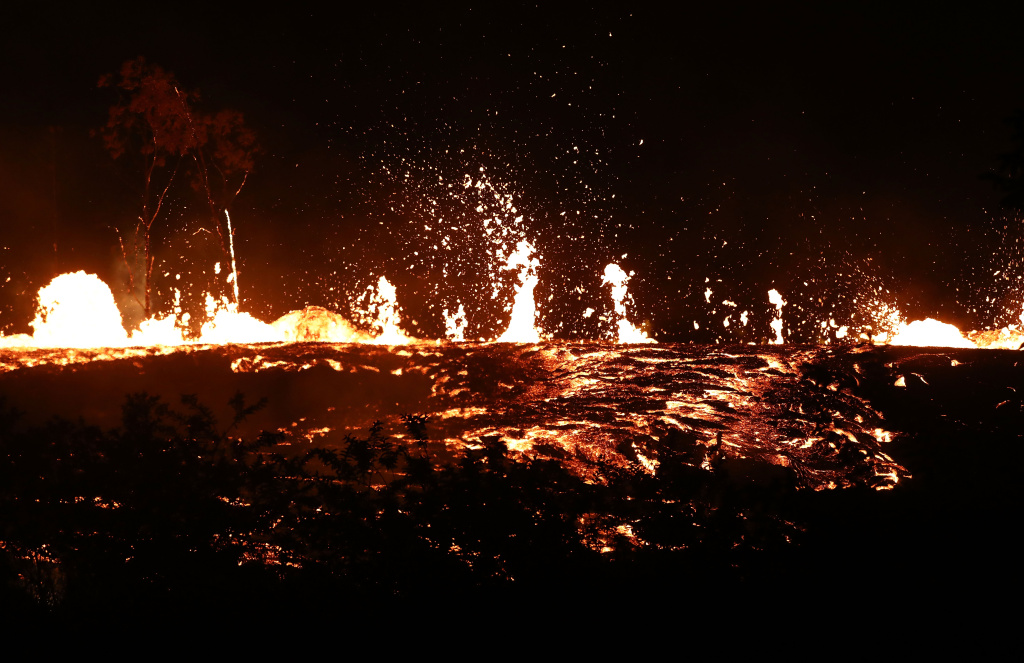 Hawaii's Kilauea Volcano Erupts Forcing Evacuations Lava erupts and flows from a Kilauea volcano fissure on Hawaii's Big Island on May 18, 2018 in Kapoho, Hawaii.
