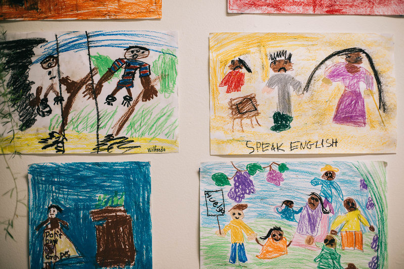 npr-15_slide-84d3d78311336aac2c1253c87266e1b0fe7e5685-s800-c85.jpg Drawings hang on the walls at Las Familias Del Pueblo.