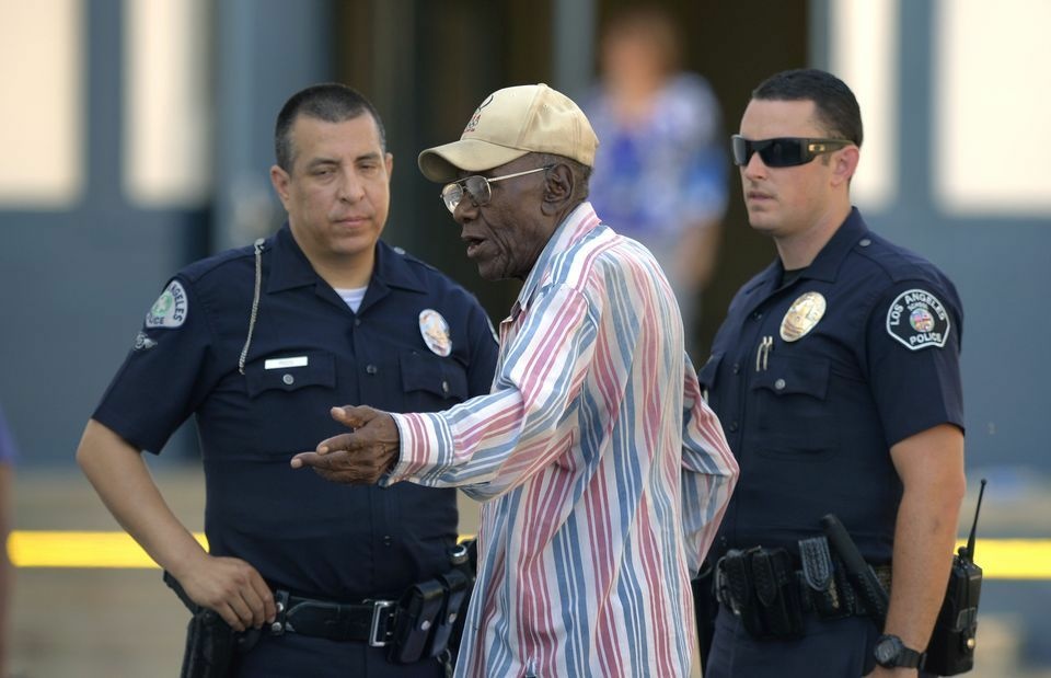 Preston Carter, 100, talks with police officers after police say his car went onto a sidewalk and plowed into a group of parents and children outside a South Los Angeles elementary school, Wednesday, Aug. 29, 2012. Nine children and two adults were injured in the wreck. Preston Carter, 100, talks with police officers after police say his car went onto a sidewalk and plowed into a group of parents and children outside a South Los Angeles elementary school, Wednesday, Aug. 29, 2012. Nine children and two adults were injured in the wreck.