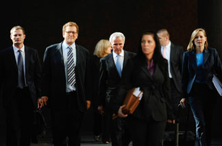 Frank McCourt (center) leaves Los Angeles County Superior Court with his legal team on Aug. 20, 2010, after the first day of a non-jury divorce trial.