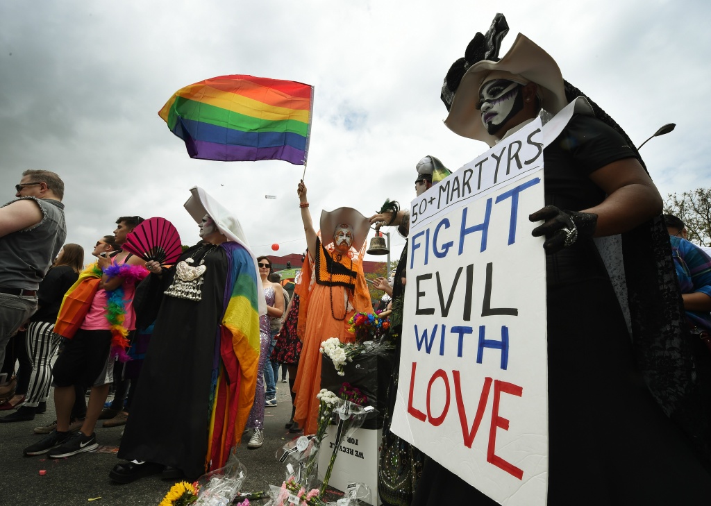 US-CRIME-SHOOTING-PARADE-SECURITY Participants show their support for victims of the Orlando shooting during the 2016 Gay Pride Parade on June 12, 20116 in Los Angeles, California.