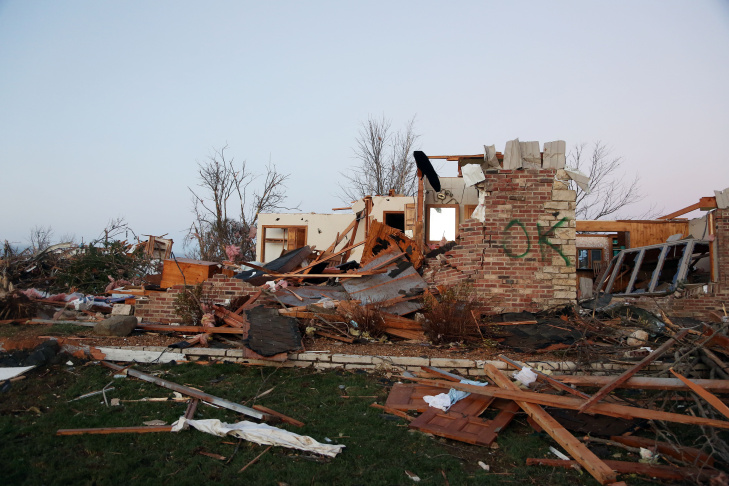A firefighter searches through debris after a tornado struck on November 17, 2013 in Washington, Illinois. Several tornadoes touched down across the Midwest today with at least three people reported dead in Illinois. 