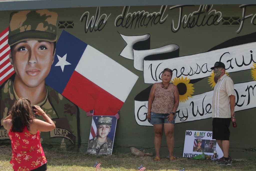Larissa Martinez of the organization Circle of Arms takes photos at the unveiling of a San Antonio mural. It pays tribute to Vanessa Guillen and Gregory Wedel Morales, two Fort Hood soldiers who were found dead near the base in separate incidents this year. Larissa Martinez of the organization Circle of Arms takes photos at the unveiling of a San Antonio mural. It pays tribute to Vanessa Guillen and Gregory Wedel Morales, two Fort Hood soldiers who were found dead near the base in separate incidents this year.
