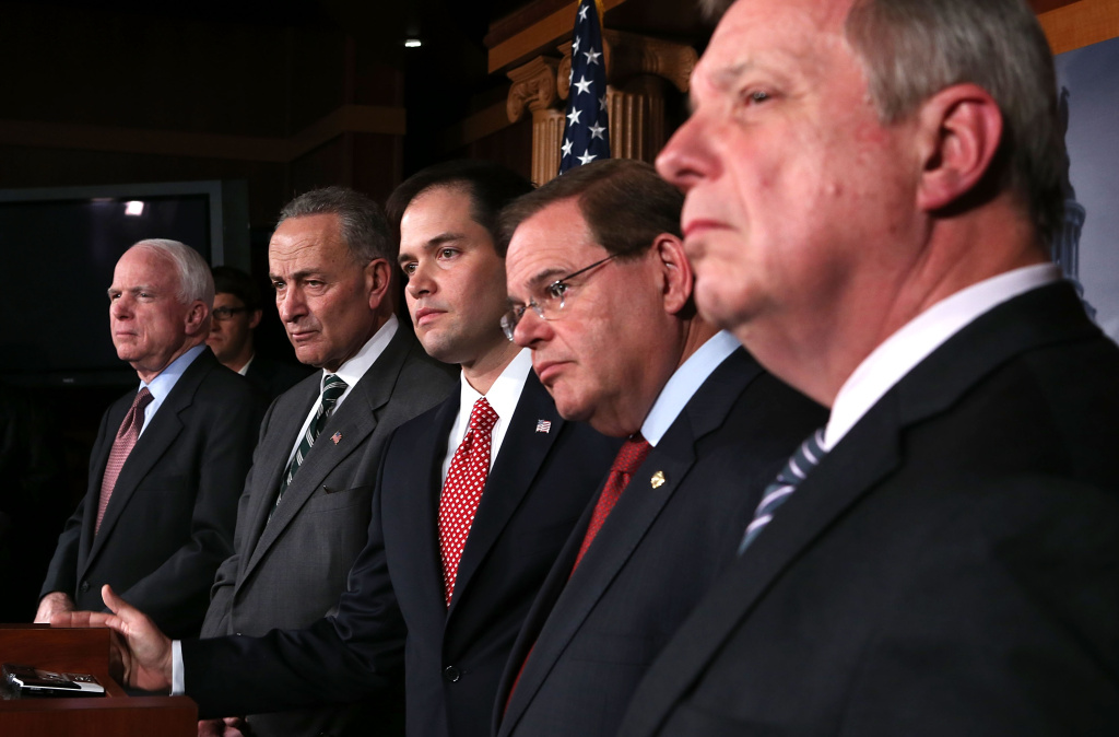 Bipartisan Group Of Senators Announce Major Agreement On Immigration Reform (L-R) U.S. Sen. John McCain (R-AZ), Sen. Charles Schumer (D-NY), Sen. Marco Rubio (R-FL), Sen. Robert Menendez (D-NJ), and Senate Majority Whip Sen. Richard Durbin (D-IL) listen during a news conference on a comprehensive immigration reform framework January 28, 2013 on Capitol Hill in Washington, DC. A group of bipartisan senate members have reached to a deal of outlines to reform the national immigration laws that will provide a pathway for the 11 million illegal immigrants in the country to citizenship.