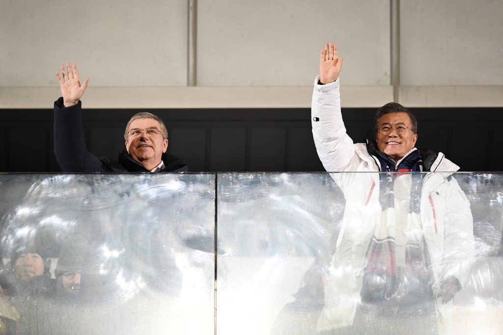 2018 Winter Olympic Games - Opening Ceremony President of the International Olympic Committee Thomas Bach (left) and South Korea's President Moon Jae-in (center) wave during the opening ceremony.