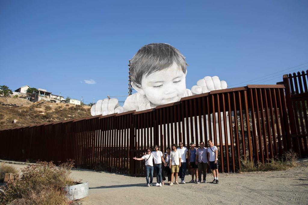 The Frame Slideshow Meet French artist JR, the man behind the border