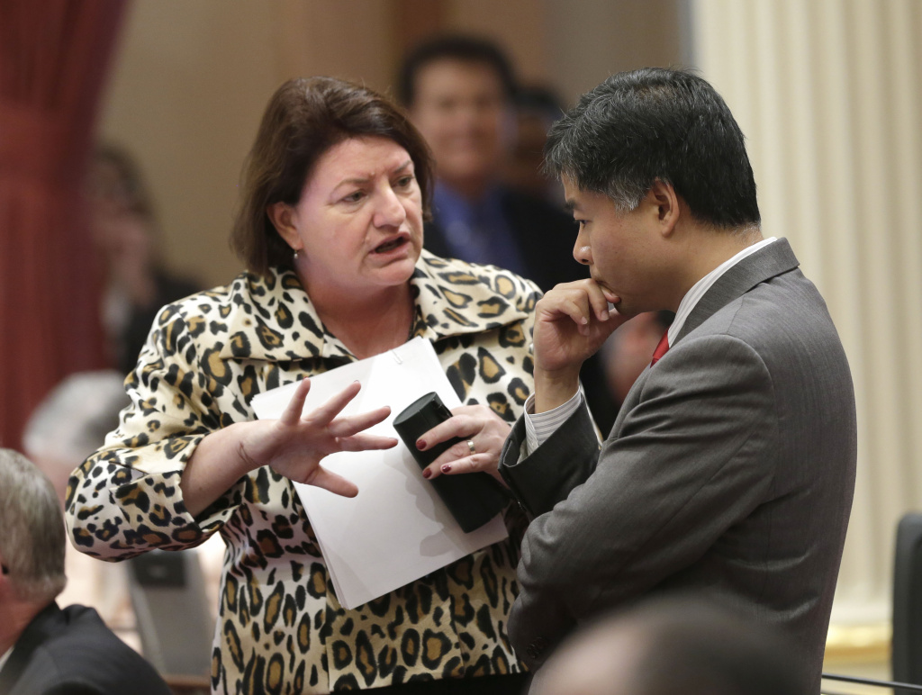 In this photo taken Sept. 3, 2013, Assemblywoman Toni Atkins, D-San Diego, talks with Sen. Ted Lieu, D-Torrance, at the Capitol in Sacramento, Calif. Gov. Jerry Brown signed Atkins bill, AB154, that will allow Nurse practitioners, certified nurse midwives and physician assistants in California to perform a type of early abortion, Wednesday, Oct, 9, 2013. But opponents have been approved to begin a signature-gathering referendum campaign to put the issue before voters.