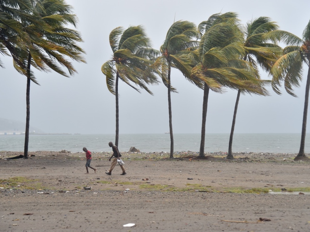 gettyimages-843821304-f8c6c8c48497d594c06867d9735b88d107c1d6f7-s1200.jpg People walk through the wind and rain on a beach in Cap-Haitien on Thursday, as Hurricane Irma approaches.