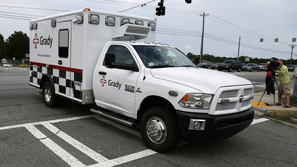 An ambulance departs Dobbins Air Reserve Base in Marietta, Ga., Saturday. Officials at Emory University Hospital in Atlanta say an American who was infected with the Ebola virus was to be transported there today. An ambulance departs Dobbins Air Reserve Base in Marietta, Ga., Saturday. Officials at Emory University Hospital in Atlanta say an American who was infected with the Ebola virus was to be transported there Saturday, Aug. 2, 2014.
