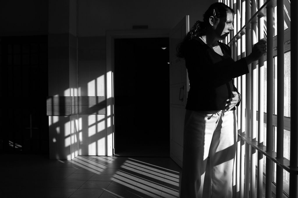 33 year-old and six month pregnant Spani 33 year-old and six month pregnant Spanish Rosa Maria Minguez Fito looks out from a window, inside the female prison of Santa Cruz do Bispo 23 November 2007, in Porto.