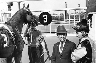 Mercer 7433 At Hollywood Park in 1966, trainer John Longden gives jockey Bill Shoemaker riding instructions for