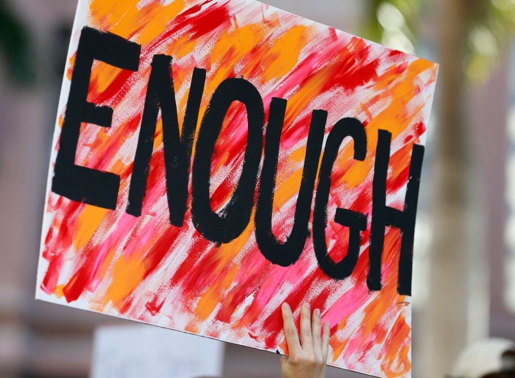 US-SCHOOL-SHOOTING-PROTEST Protesters hold signs at a gun control at the Broward County Federal Courthouse in Fort Lauderdale, Florida on February 17, 2018.