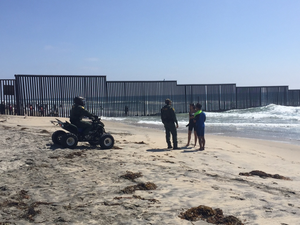 Surf Border Border Patrol Warning U.S. Customs and Border Patrol agents talk with participants in the