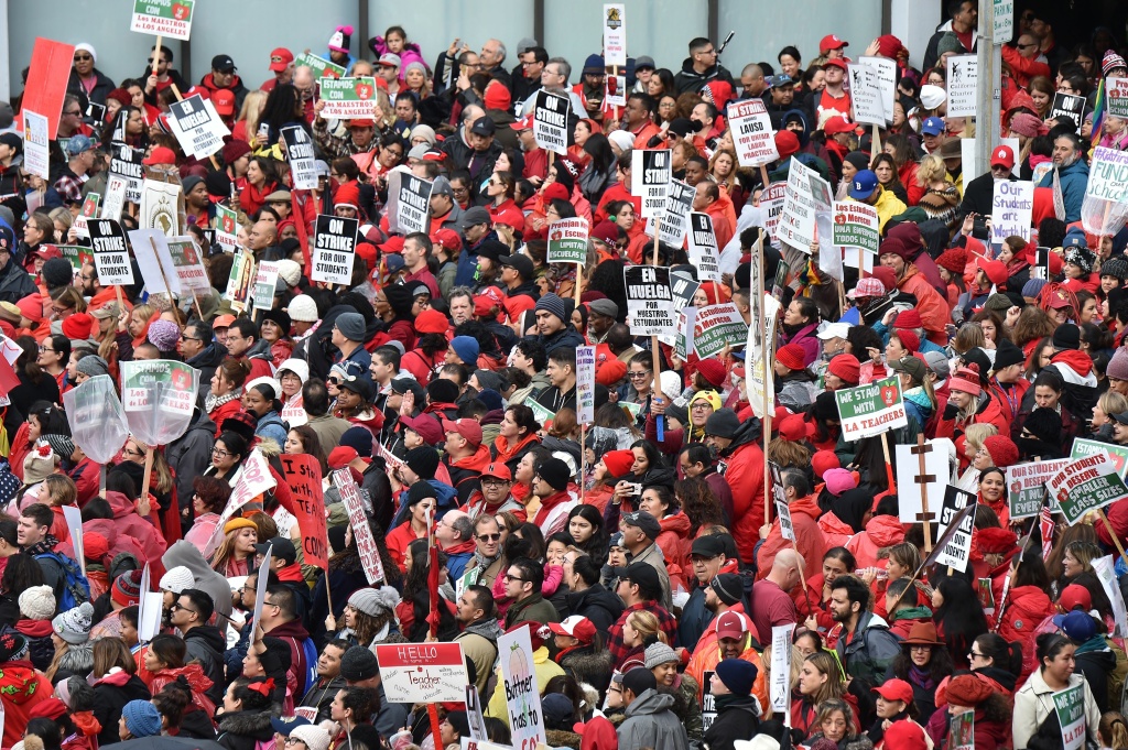 Striking teachers and their supporters rally in downtown Los Angeles, California on the second day of the teachers strike, on January 15, 2019. Striking teachers and their supporters rally in downtown Los Angeles, California on the second day of the teachers strike, on January 15, 2019. - Teachers of the Los Angeles Unified School District (LAUSD), the second largest public school district in the United States, are striking for smaller class size, better school funding and higher teacher pay. (Photo by Robyn Beck / AFP) (Photo credit should read ROBYN BECK/AFP/Getty Images)
