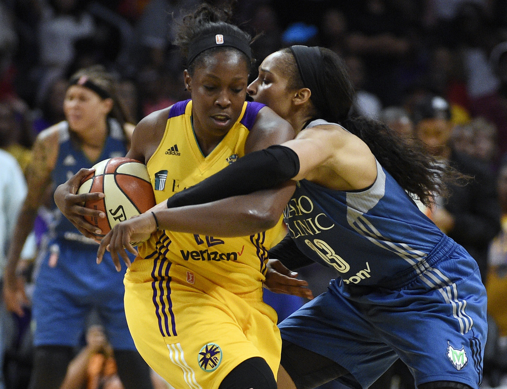 WNBA Finals - Game Three Chelsea Gray #of the Los Angeles Sparks is fouled by Maya Moore of the Minnesota Lynx during the second half of Game Three of the 2017 WNBA Finals.