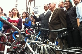 Bike enthusiasts and Mayor Antonio Villaraigosa (center) celebrate the new LA city bike plan outside City Hall on March 2, 2011 in Los Angeles.