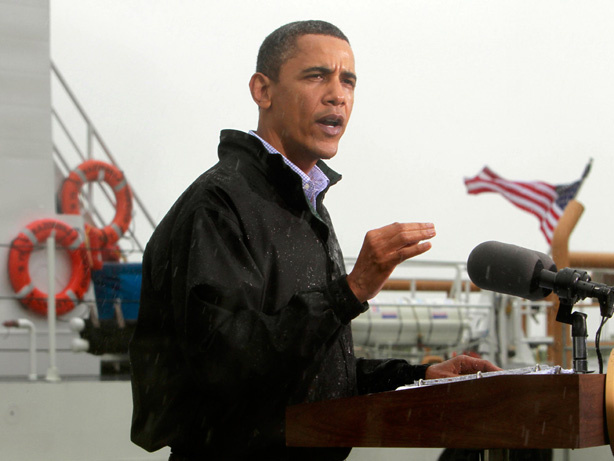 President Obama, standing in the rain, makes a statement to reporters in Venice, La., as he visits the Gulf Coast region affected by the oil spill on Sunday.