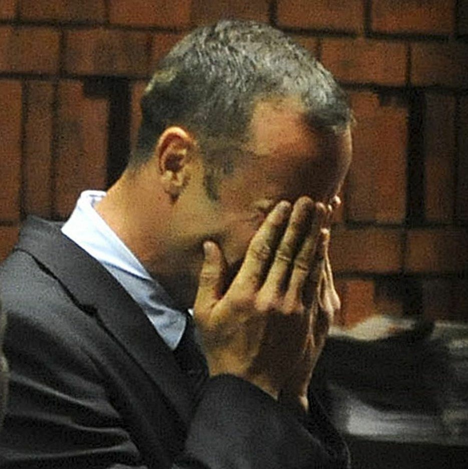 South African Paralympic and Olympic sprinter Oscar Pistorius as he wept today while being charged with murder.