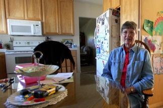 Sadyrae Sommerville sits in the kitchen of her small home, which she shares with her daughter and grandson. The family struggles to make ends meet and Sommerville relies on delivered meals from the senior center in Colusa, for lunch and dinner.