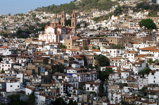 Even major tourist destinations, such as the picturesque town of Taxco in western Mexico, aren't immune to the violent onslaught. A 40-minute gun battle during the middle of the day in June left 15 people dead.