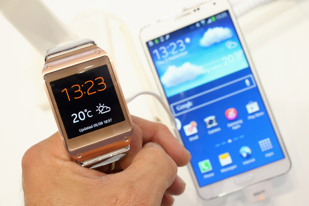 IFA 2013 Consumer Electronics Trade Fair The photographer holds the new Galaxy Gear smartwatch next to the new Galaxy Note 3 smartphone at the Samsung stand at the IFA 2013 consumer electronics trade fair on September 5, 2013 in Berlin, Germany. The 2013 IFA will be open to the public from September 6-11.