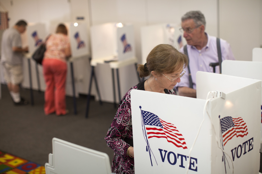 Elecion Day Evelyn Cederbaum and her husband, Stephen, right, cast their votes during the primary election at the Montana Branch Library in Santa Monica.