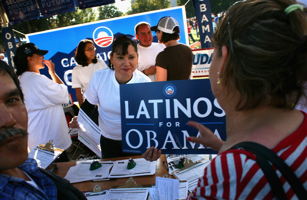 Democrats Court Latino Vote At Mexican Independence Celebration Democratic Party workers hand out signs at a celebration marking Mexican Independence Day September 14, 2008 in Denver, Colorado.