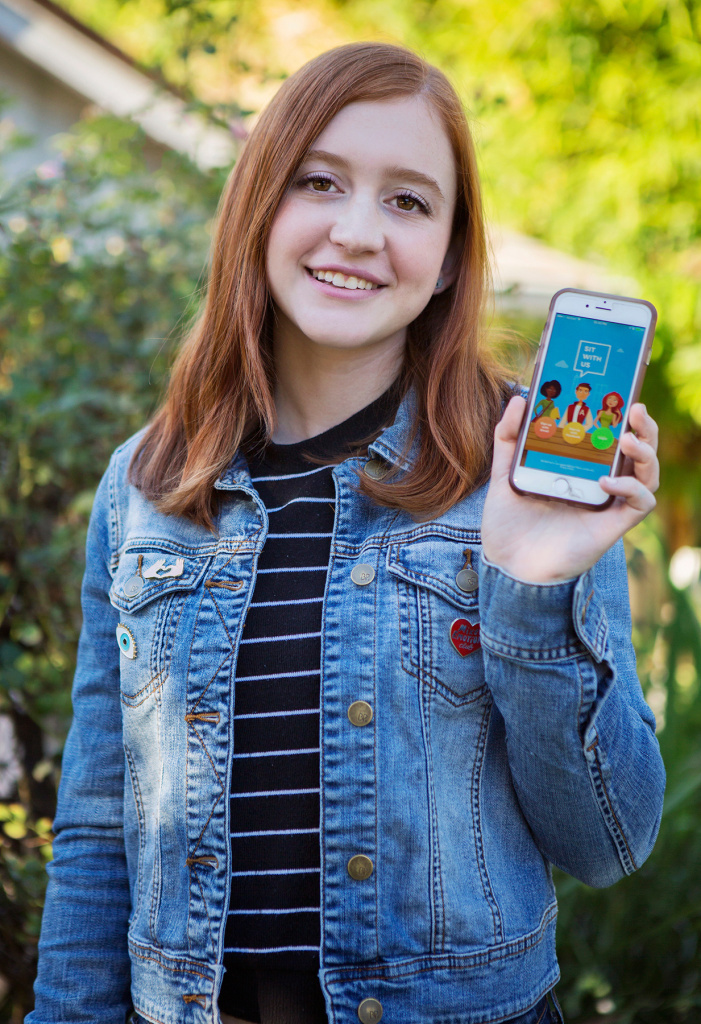 nataliehampton_enl-e678daa650f19402baa94cf1f9841351dfad512c-s1400.jpg Natalie Hampton shows off the Sit With Us app.