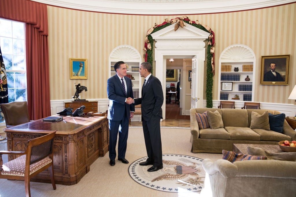 Romney Meets With Obama For Lunch At White House In this handout from the White House, Former Republican presidential candiate and Massachusetts Gov. Mitt Romney (L) shakes hands with U.S. President Barack Obama in the Oval Office following their lunch November 29, 2012 in Washington, DC . Obama had invited Romney to the White House for the lunch.