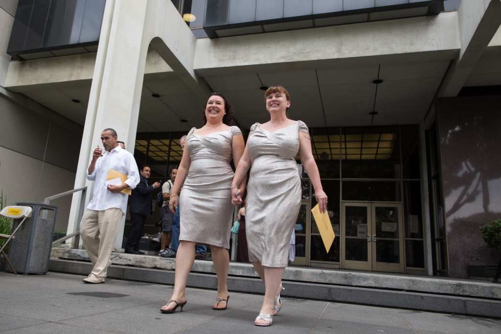 Britain has legalized gay marriage after Queen Elizabeth II gave her royal stamp of approval. The queen's approval was a formality. It clears the way for the first gay marriages next summer. (Photo: Jessica Maxwell and Shana Krochmal walk out of the Beverly Hills Courthouse on July 1st, 2013. They have been together for 5 years.)