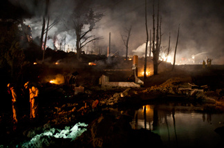 A crater filled with water marks the site of the pipeline explosion that caused a fire Sept. 9, 2010, in a San Bruno, Calif., neighborhood.