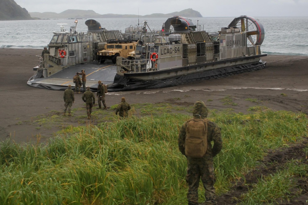 Alcac landing An LCAC, a hover-craft the Navy uses to transport material from ship to shore, lands on the beach at Kuluk Bay on Adak as part of military exercises in September.