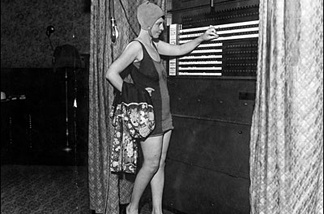 Mercer 8062 Numerous voters, desiring to spend the holiday at the beaches, dropped into their polling places clad in bathing suits on August 26, 1930. Here is Mrs. Lucile Wheat.
