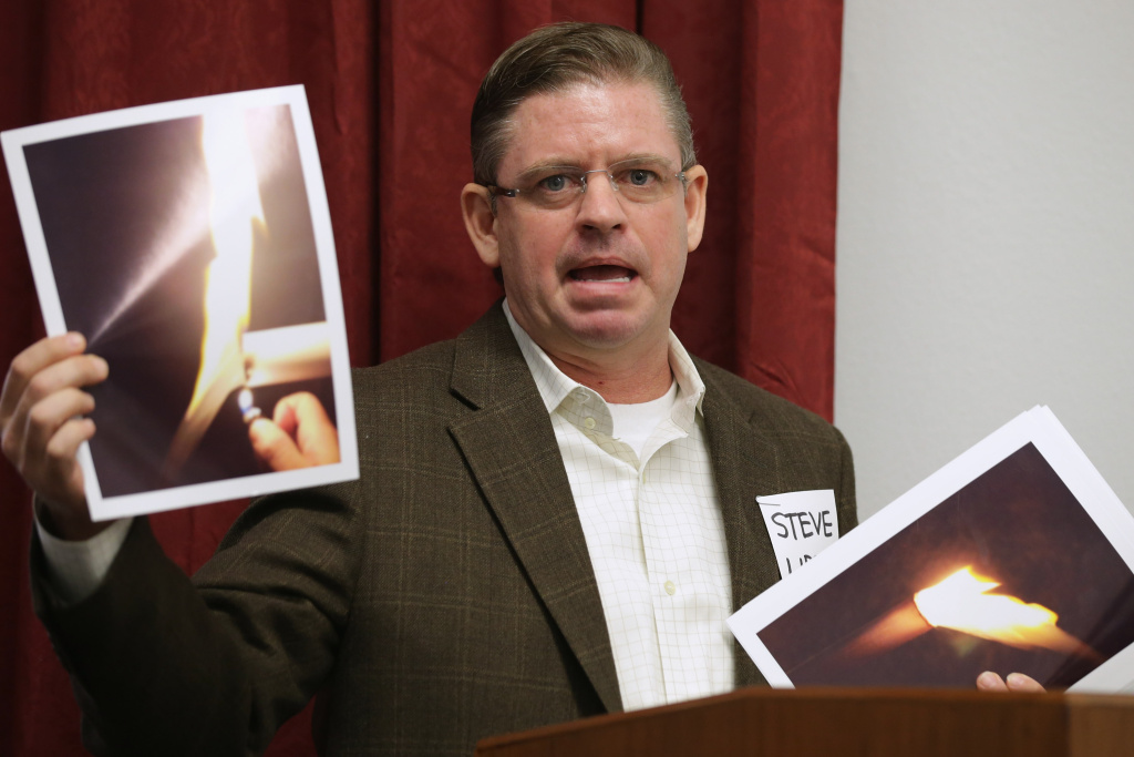 Anti-Fracking Activists Hold Briefing On Capitol Hill Steve Lipsky of Parker County, Texas, holds photographs of his well water burning during a briefing organized by anti-fracking groups at the Cannon House Office Building on Capitol Hill February 5, 2014 in Washington, DC. Lipsky's water well was the subject of an EPA emergency order after he says it was contaminated by oil and gas exploration. People from communities affected by underground hydraulic fracturing used to extract natural gas, or fracking, called on members of Congress, the Environmental Protection Agency and President Barack Obama to continue investigating the connection between fracking and residential water contamination.