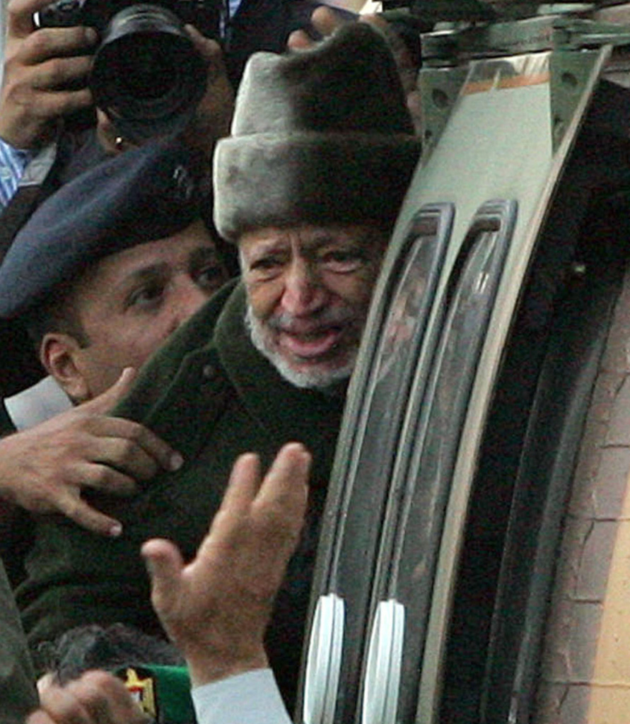 Oct. 29, 2004: Palestinian leader Yasser Arafat boards a helicopter in Ramallah, the West Bank, for the start of his journey to a hospital in France. He died 2 weeks later.
