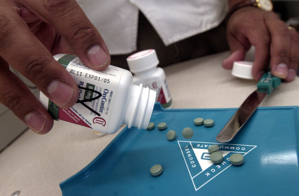 OxyContin Abuse On the Rise The prescription medicine OxyContin is displayed August 21, 2001 at a Walgreens drugstore in Brookline, MA. The powerful painkiller, manufactured to relieve the pain of seriously ill people, is being used by some addicts to achieve a high similar to a heroin rush. Its popularity among abusers of the drug has resulted in a string of pharmacy robberies nationwide. Armed robbers raid the pharmacies for the painkiller which has a street value of $40 for a 40mg pill.
