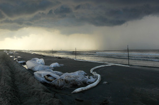 Bags of oil collected from the beach await pickup at Elmer's Island, Louisiana. (Photo by John Moore/Getty Images)