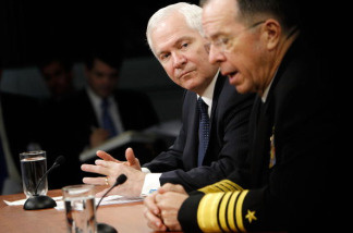 ARLINGTON, VA - MARCH 25: U.S. Secretary of Defense Robert Gates (L) and Chairman of the Joint Chiefs of Staff Admiral Michael Mullen (R) speak to members of the media during a press briefing at the Pentagon March 25, 2010 in Arlington, Virginia. Gates announced that the Pentagon will ease the enforcement of the 'Don't Ask, Don't Tell' policy.