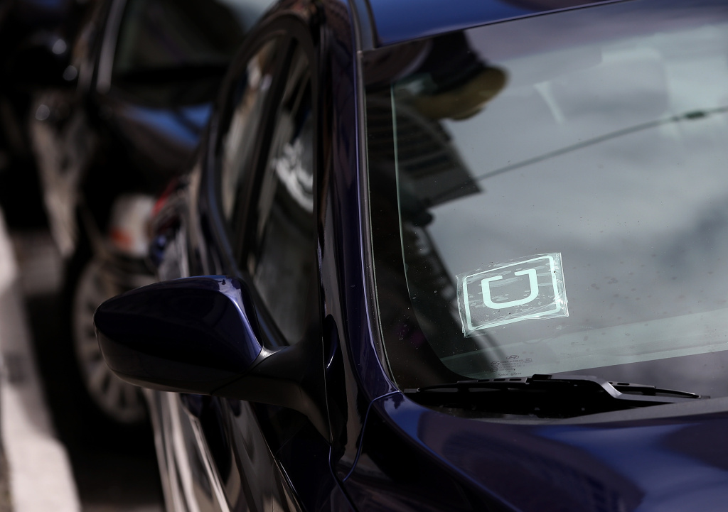 App Car Service Startups Continue To Irk Traditional Cab Companies And Regulators A sticker with the Uber logo is displayed in the window of a car on June 12, 2014 in San Francisco, California.