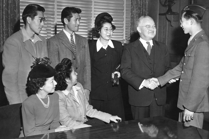 January 15, 1945: Mayor Bowron welcomes Japanese back to LA. L-R: (seated): Mrs. Melba Matsuuro, Mary Yoshimizu; (standing): Jack Yoshimizu, Henry Yoshimizu, Meriko Hoshigama, Mayor Bowron, and Harley M. Oka. Speaking on December 18, 1944, Mayor Bowron said he was fearful that the return of the Japanese might lead to a serious outbreak of race riots and impose a heavy burden on law officers.
January 15, 1945: Mayor Bowron welcomes Japanese back to LA. L-R: (seated): Mrs. Melba Matsuuro, Mary Yoshimizu; (standing): Jack Yoshimizu, Henry Yoshimizu, Meriko Hoshigama, Mayor Bowron, and Harley M. Oka. Speaking on December 18, 1944, Mayor Bowron said he was fearful that the return of the Japanese might lead to a serious outbreak of race riots and impose a heavy burden on law officers.