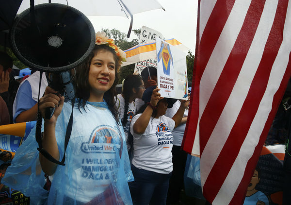 DACA 2 Claudia Quiñonez (center) leads protesters in a chant at a rally for DACA in Washington, D.C.