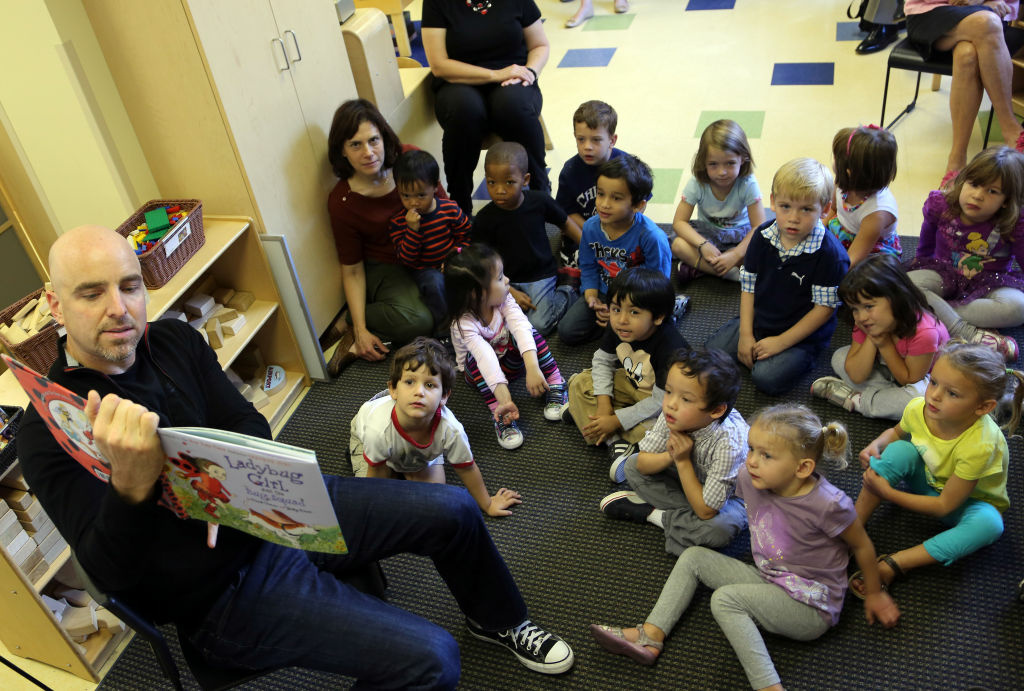 Bright Horizons And Jumpstart Chicago Celebrate Read For The Record Brad Keywell co-founder and Director of Groupon reads to children at Bright Horizons on October 4, 2012 in Chicago, Illinois.