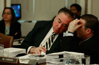 Rep. Dennis Cardoza (D-CA) speaks with an aide during a House Rules Committee meeting on Capitol Hill November 6, 2009 in Washington, DC.