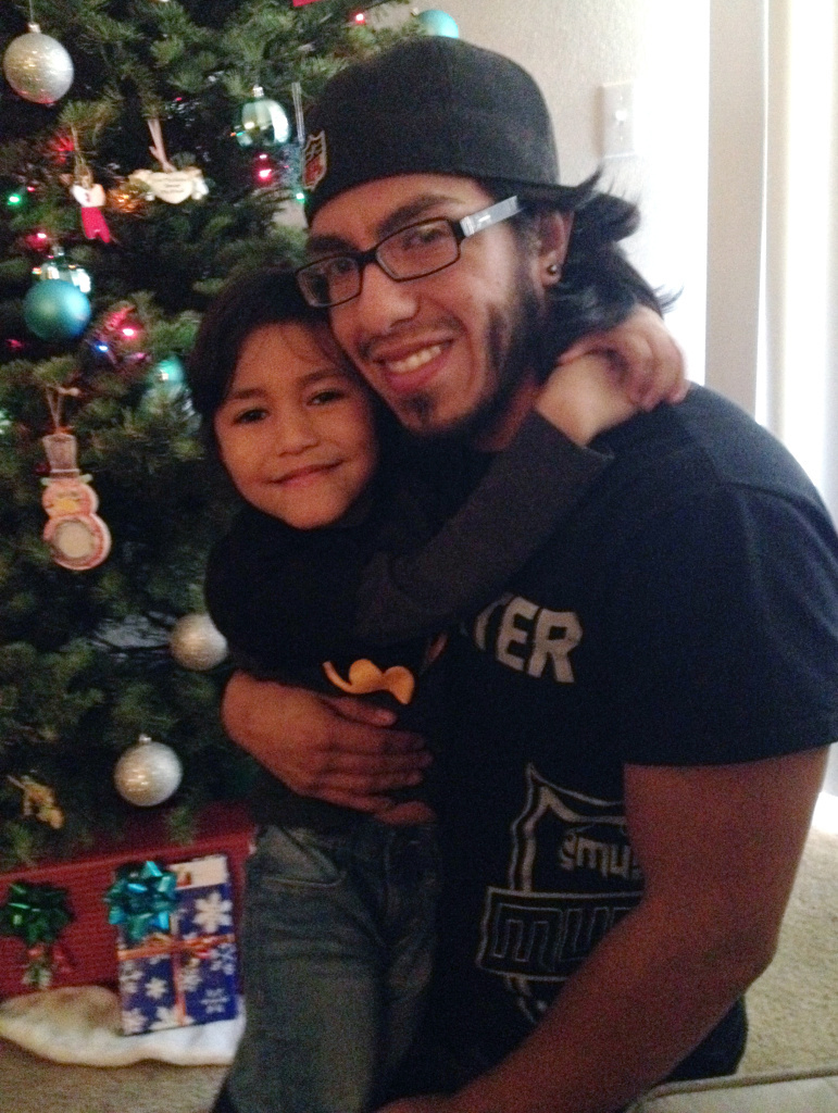 Manny Cardenas, seen here with his 5-year-old daughter Zoe, has earned $16 an hour as a part-time security guard at Google.