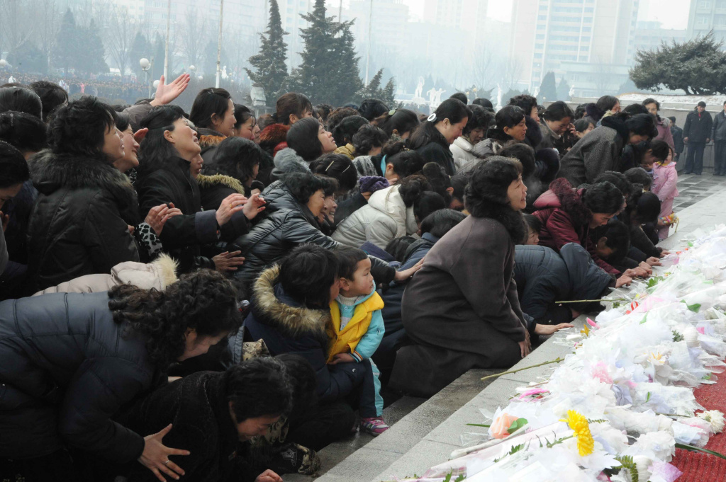 This picture taken on December 21, 2011 This picture taken on December 21, 2011 shows Pyongyang citizens gathering to mourn the late North Korean leader Kim Jong-il at the Pyongyang Gymnasium.