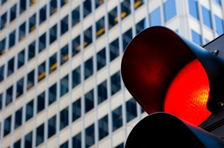 A traffic signal shows red.