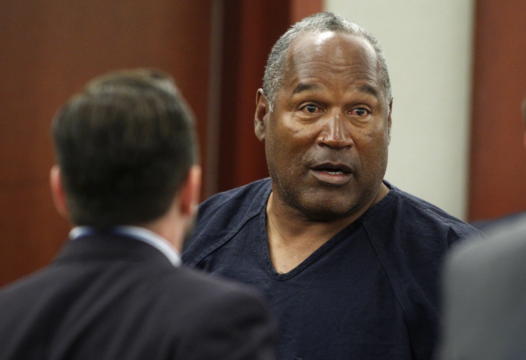 O.J. Simpson should know next week whether his blemish-free record behind bars and contrition for trying to take back sports memorabilia of his glory days will win him favor with the Nevada Board of Parole Commissioners. (File photo: O.J. Simpson (R) stands at the end of a hearing in Clark County District Court on May 17, 2013 in Las Vegas, Nevada). O.J. Simpson should know next week whether his blemish-free record behind bars and contrition for trying to take back sports memorabilia of his glory days will win him favor with the Nevada Board of Parole Commissioners. (File photo: O.J. Simpson (R) stands at the end of a hearing in Clark County District Court on May 17, 2013 in Las Vegas, Nevada).